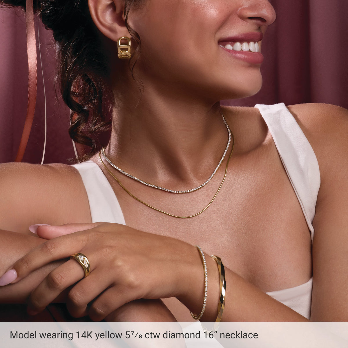 Styling reference: model wearing a 14K yellow gold diamond tennis necklace; other jewelry not included