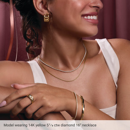 Styling reference: model wearing a 14K yellow gold diamond tennis necklace; other jewelry not included